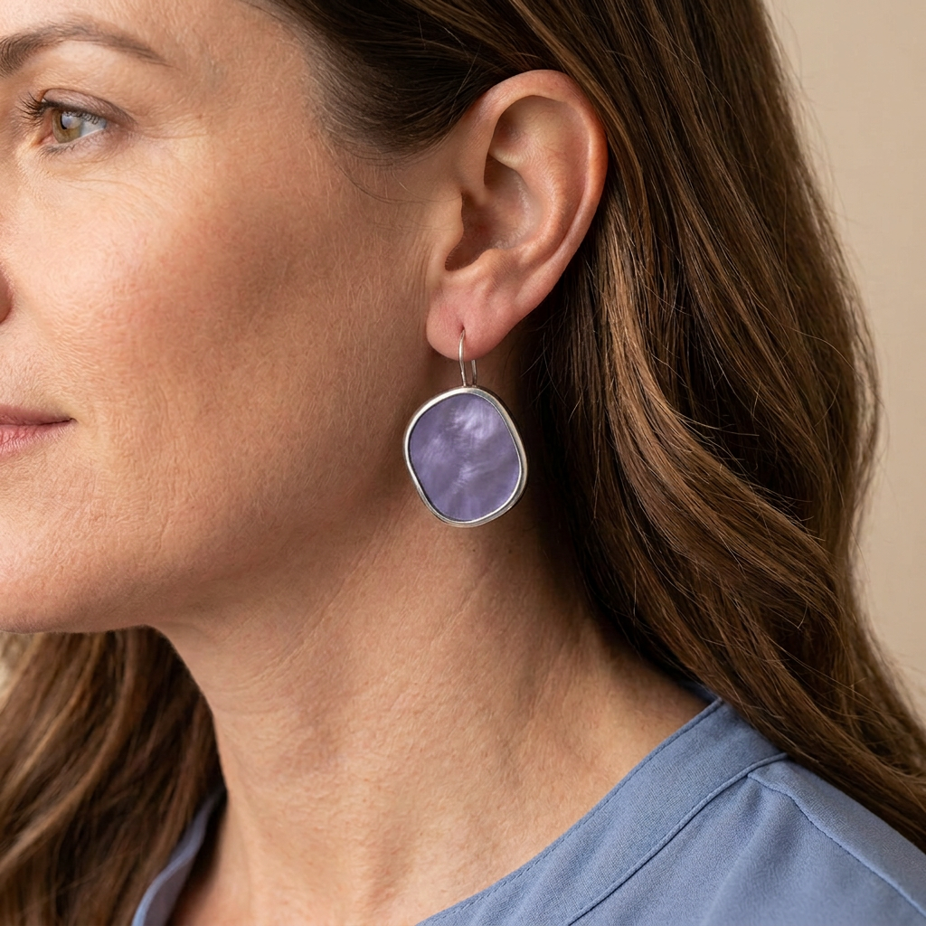Lavender earring on a model with more consistent color and reduced highlights