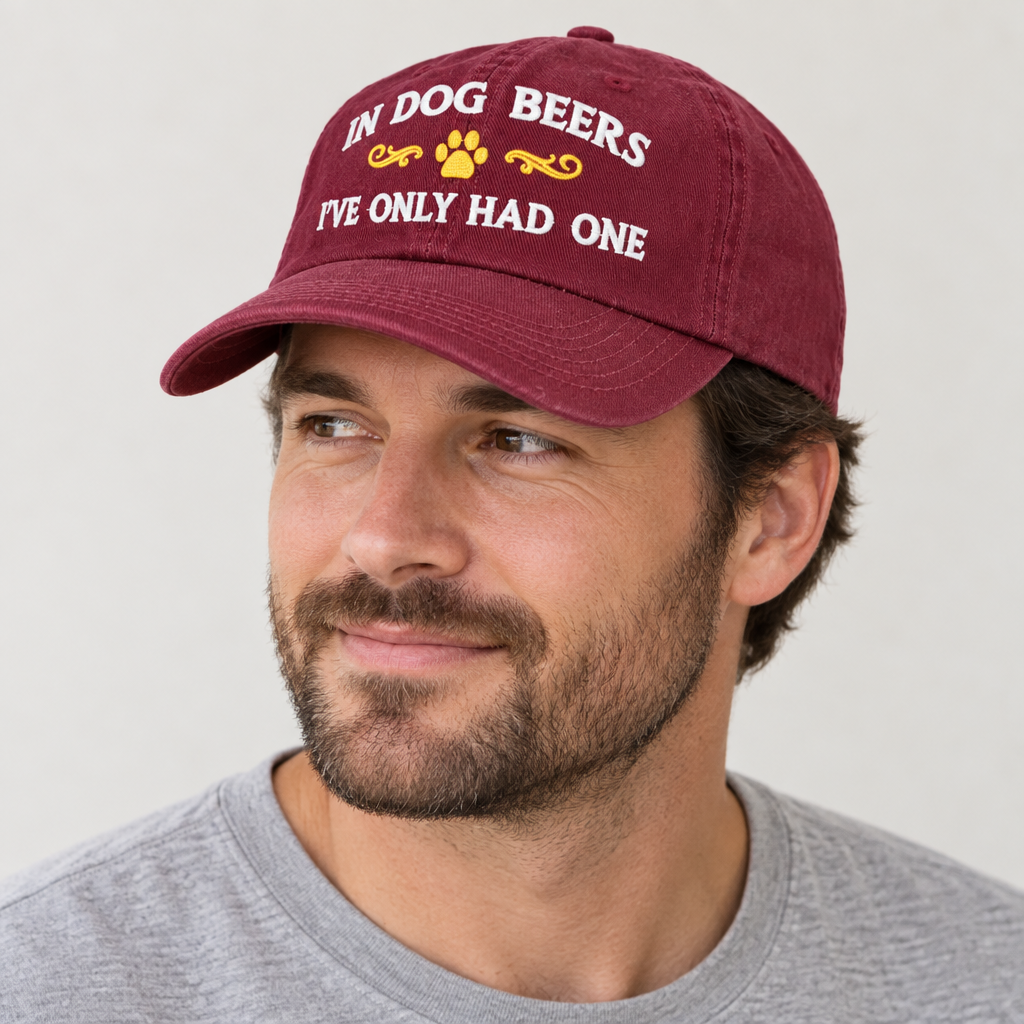 Man wearing the burgundy Dog Beers hat and looking to his right