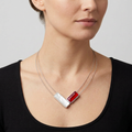 Model wearing the necklace with a richer red rectangle