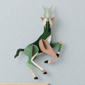 Tight close-up of antelope wall art on a pale grey-blue wall, without the bed