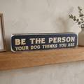 Tighter square framing of the sign on the fireplace mantel